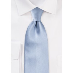 Solid colored light blue silk tie